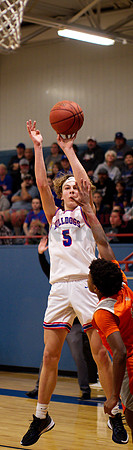 _1058632 Brady Floyd shoots over Xzavien Lipscomb