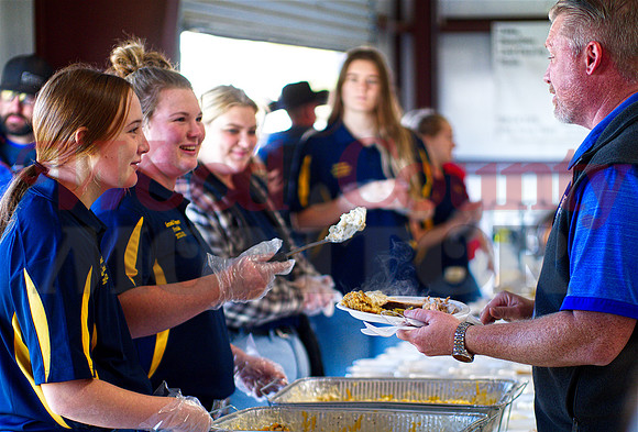_1197088 Kori Hammond and Kennedi Elmore serve supt-to-be Chris Mason