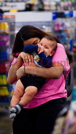 _1218073 Thea Addicks hugs Cassius in checkout line