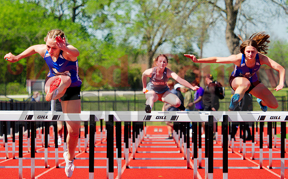 _1136730 Savana Smith and Gracie Linley and Bonnie Vander Schaaf run 100m hurdles