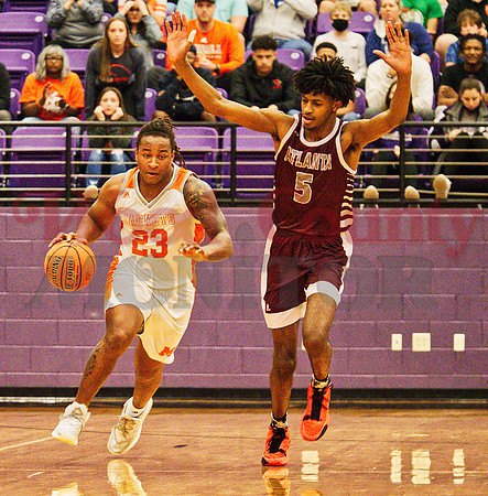 _1184604 Trevion Sneed 23 dribbles past Daimion Collins 5