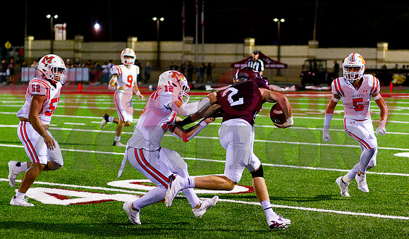 _1310269 Braelyn Geremonte grasps ballcarrier