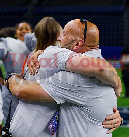 _1398141 Donald Myers and Jim Best embrace